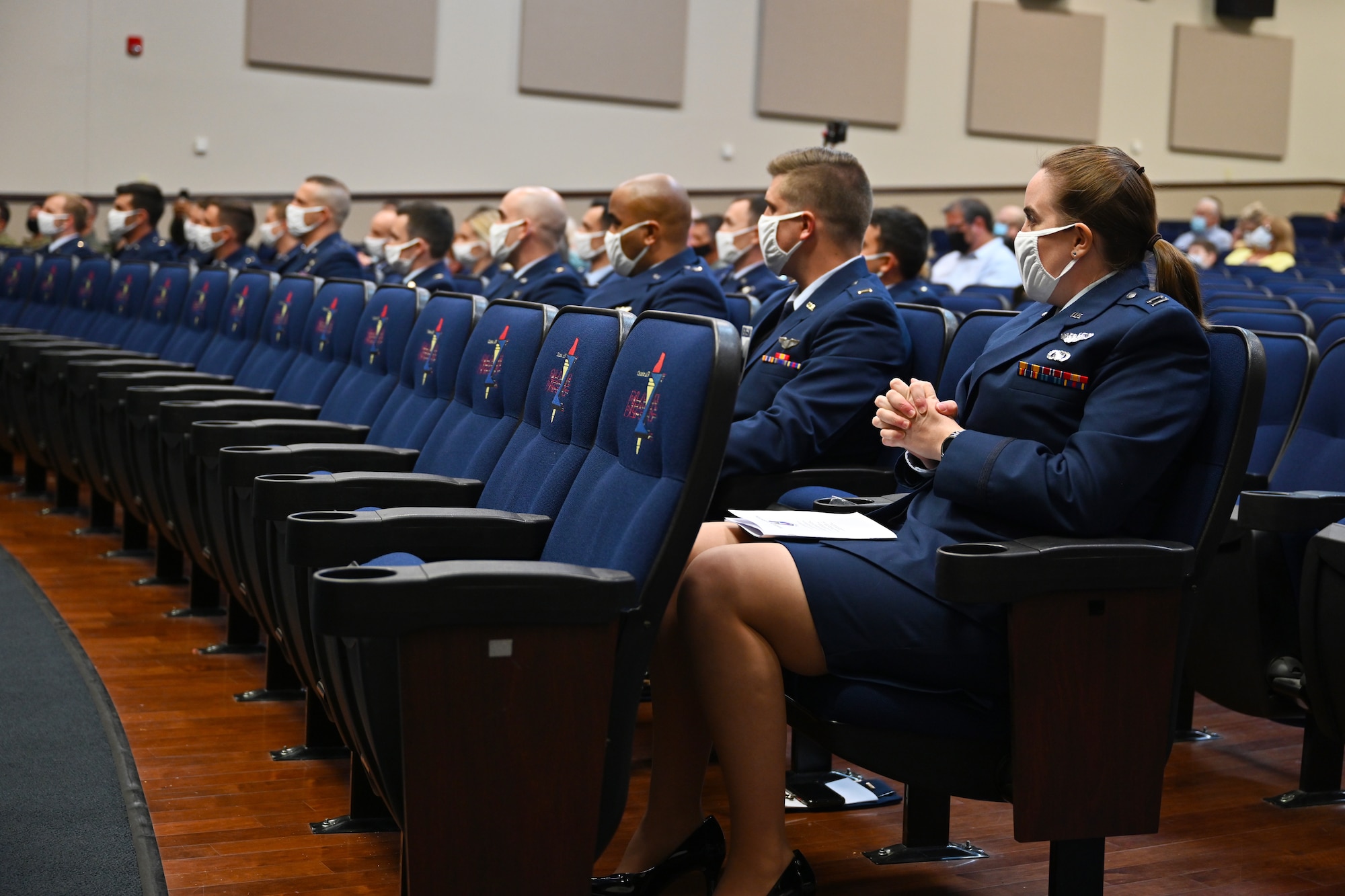Graduates from Specialized Undergraduate Pilot Training Class 21-09 sit in the Kaye Auditorium during their graduation ceremony, May 7, 2021, on Columbus Air Force Base, Miss. The distinguished graduates of Class 21-09 were 2nd Lt. Samuel Rexroad and 2nd Lt. William Talbott for outstanding performance in academics, officer qualities and flying abilities. (U.S. Air Force photo by Senior Airman Jake Jacobsen)