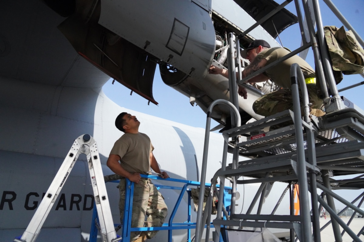 U.S. Air National Guard Senior Airman Kyle George and Staff Sgt. Matthew Ortiz from the 146th Maintenance Group repair a Nacelle Interface Unit (NIU) on a MAFFS (Modular Airborne Fire Fighting System) C-130J Hercules Aircraft during MAFFS certification and training at San Bernardino Air Tanker Base, California, May 6, 2021. The MAFFS aircrew relies heavily on its maintenance crew to prepare the aircraft to accomplish its aerial firefighting certification. (U.S. Air National Guard photo by Senior Airman Michelle Ulber)