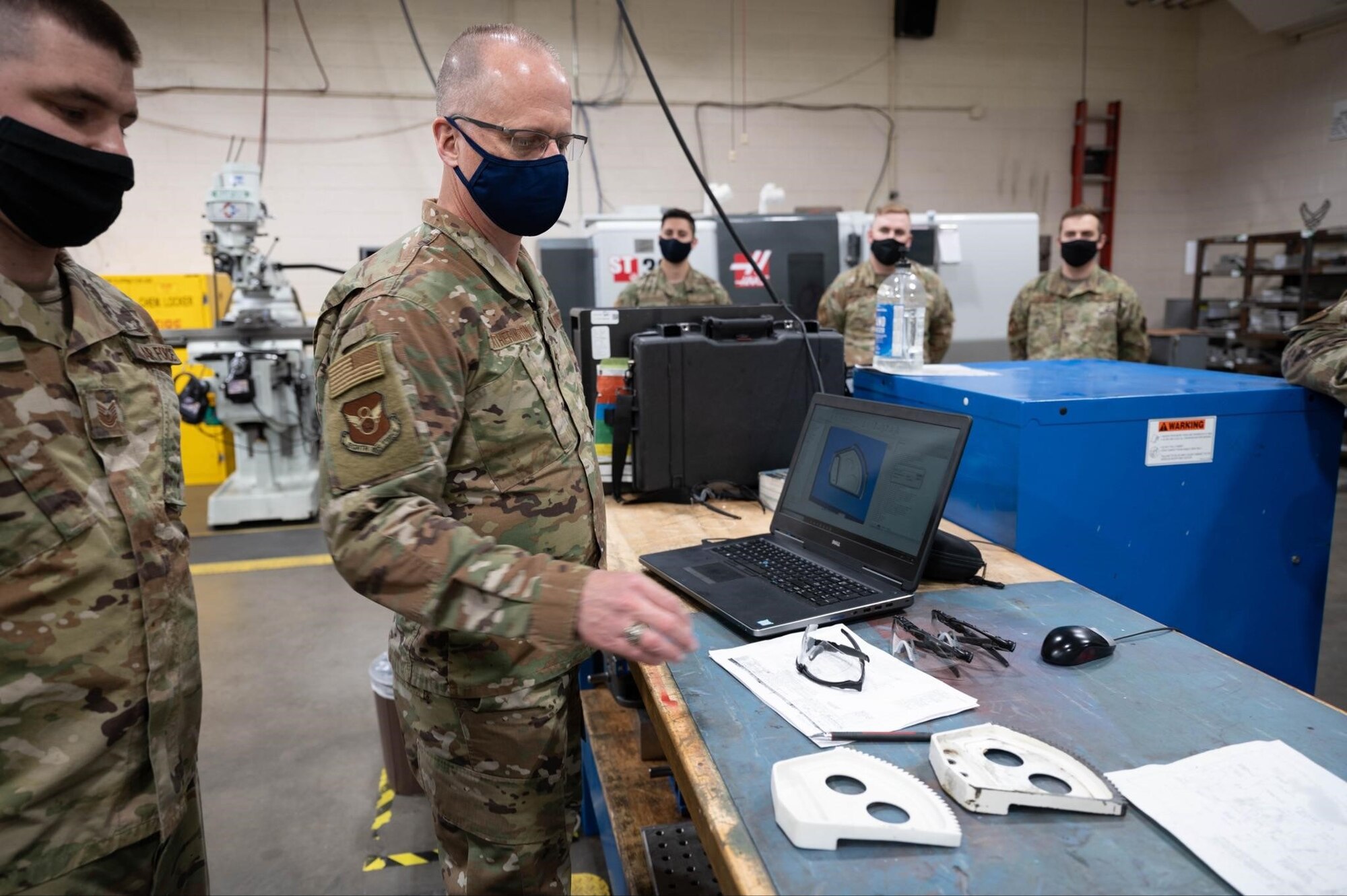 Maj. Gen. Mark Weatherington, the 8th Air Force and Joint-Global Strike Operations Center commander, reviews locally manufactured B-1B Lancer parts during his visit to Ellsworth Air Force Base, S.D., May 4, 2021.