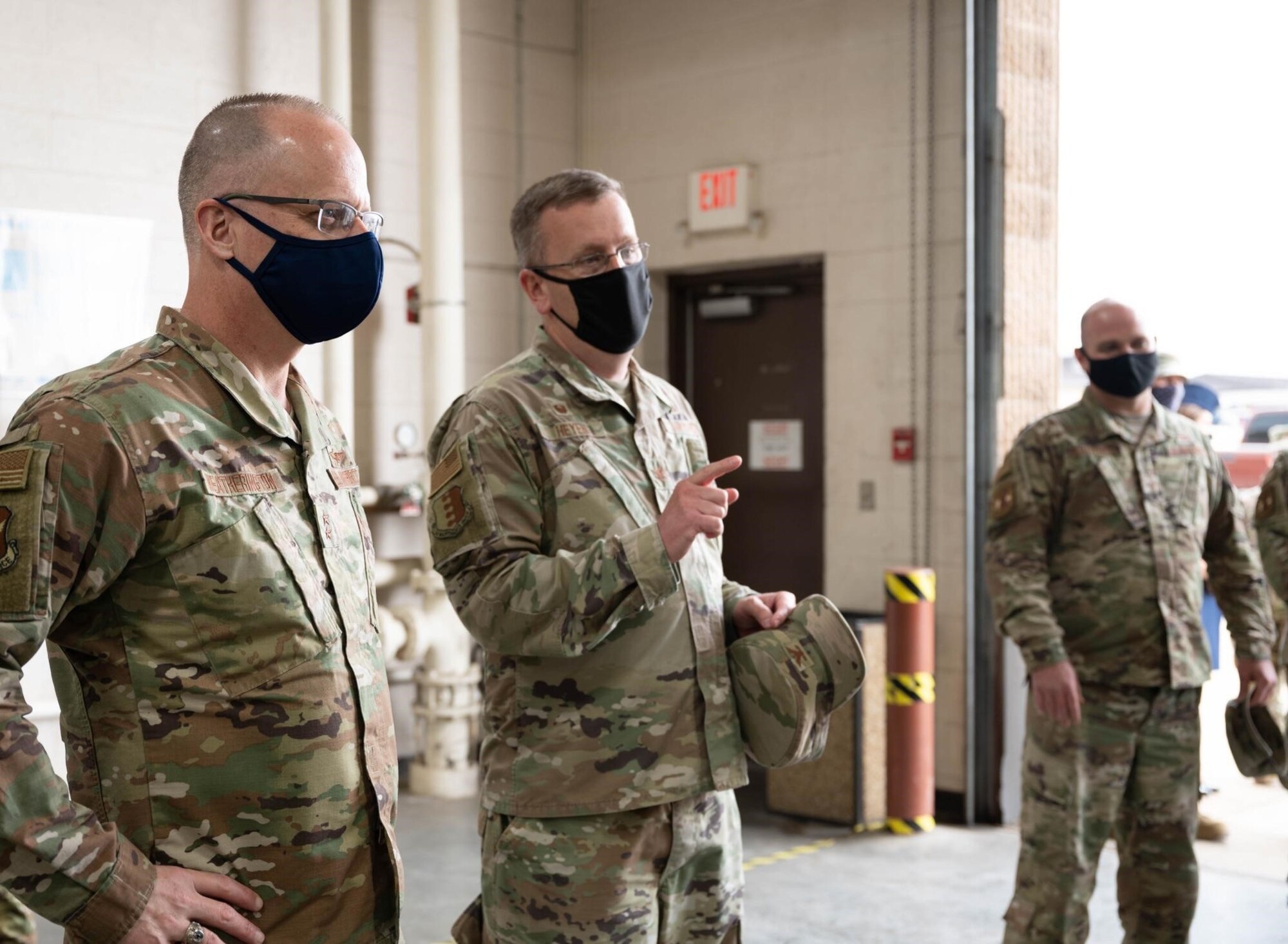 Col. Chad Heyen, the 28th Maintenance Group commander, center, discusses the capabilities and innovation opportunities of the Metals Technology and additive manufacturing facility with Maj. Gen. Mark Weatherington, the 8th Air Force and Joint-Global Strike Operations Center commander, left, during his visit to Ellsworth Air Force Base, S.D., May 4, 2021.