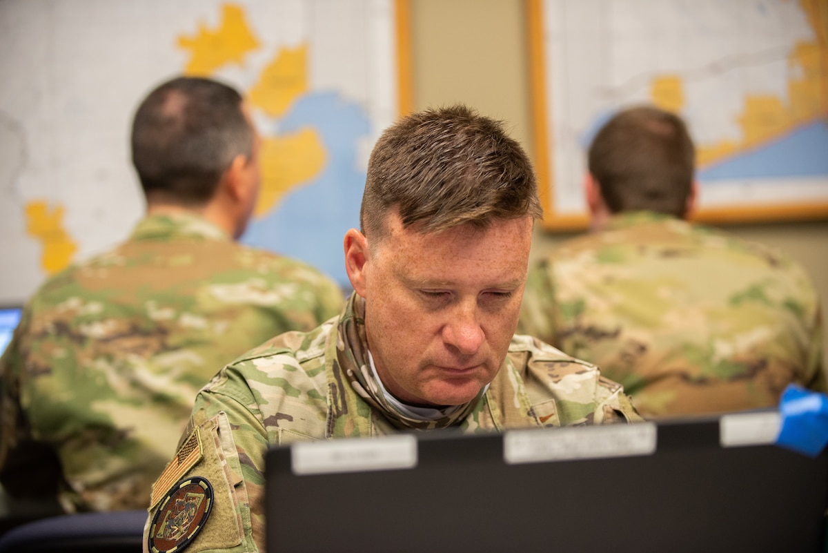 U.S. Air Force Senior Master Sgt. Brian Mohr, the cyber noncommissioned officer in charge for the 175th Cyber Operations Group, Maryland Air National Guard, works on a computer April 21, 2021, at the Gulfport Combat Readiness Training Center, Gulfport, Mississippi.