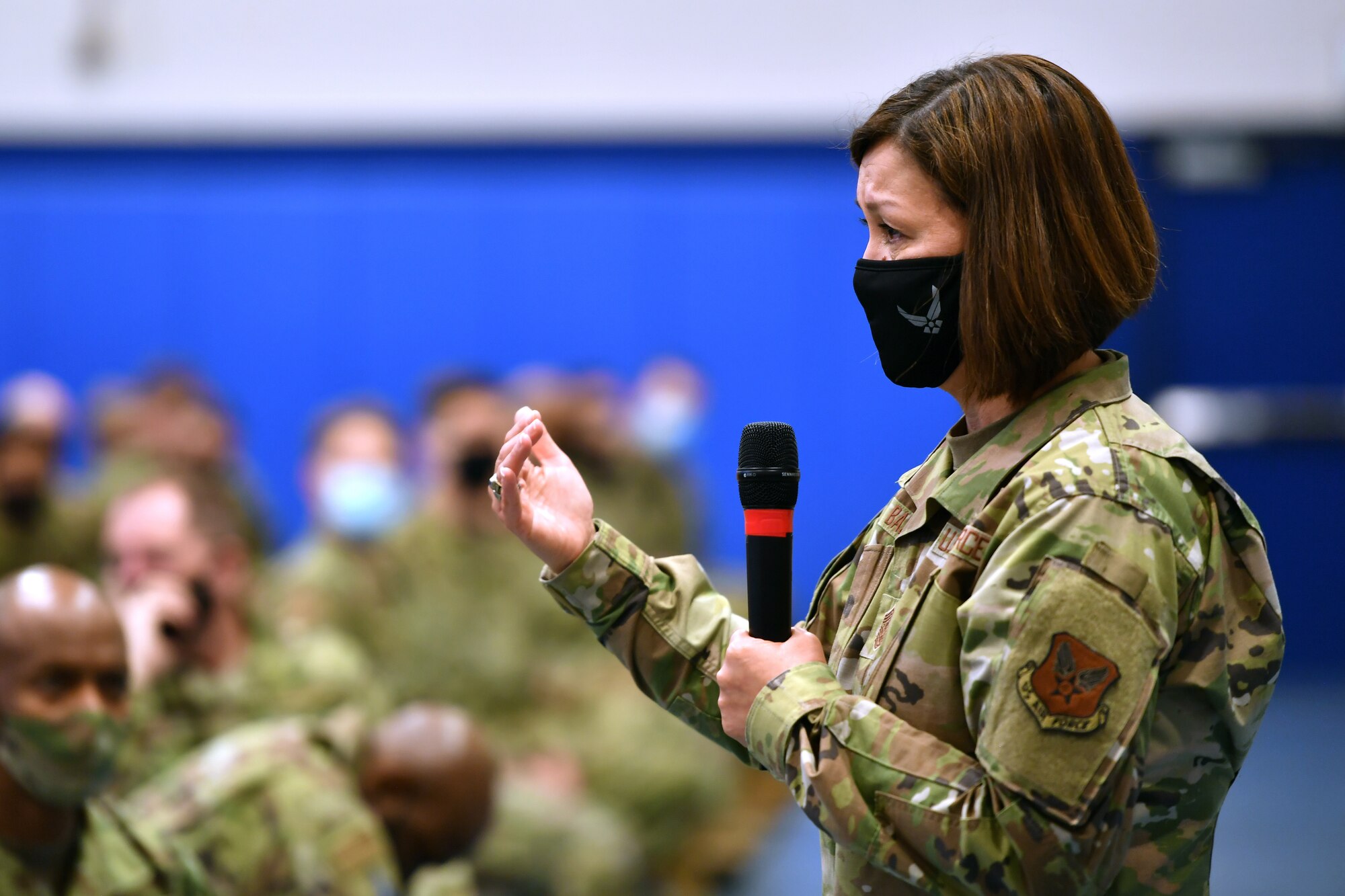 Chief Bass speaks at an all call at Shriever Air Force Base