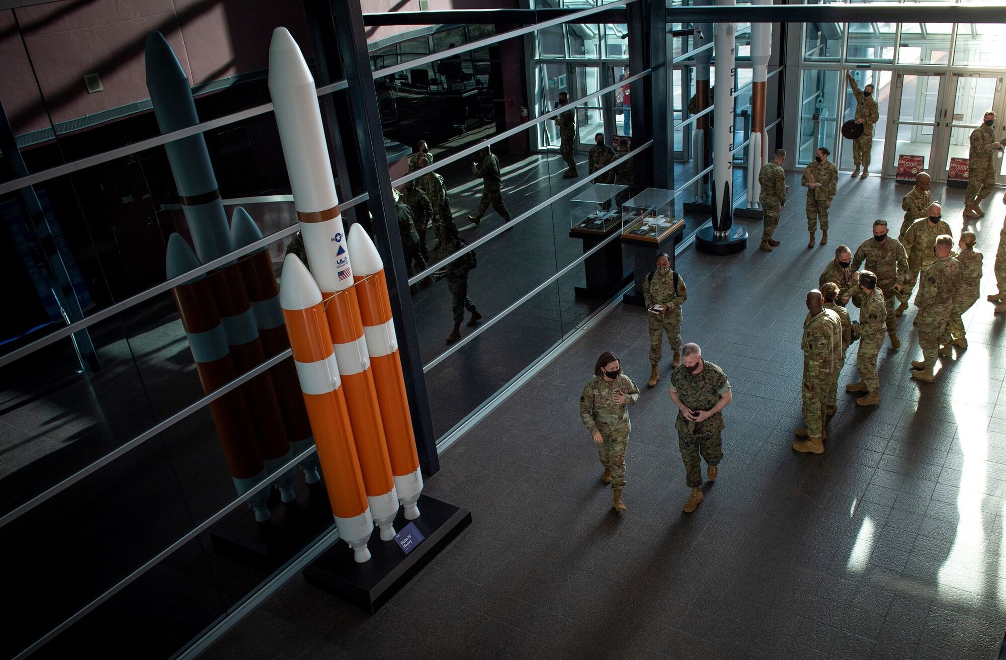 U.S. Marine Corps Master Gunnery Sgt. Scott Stalker welcomes Chief Master Sergeant of the Air Force JoAnne Bass to U.S. Space Command headquarters May 7 at Peterson Air Force Base, Colorado.