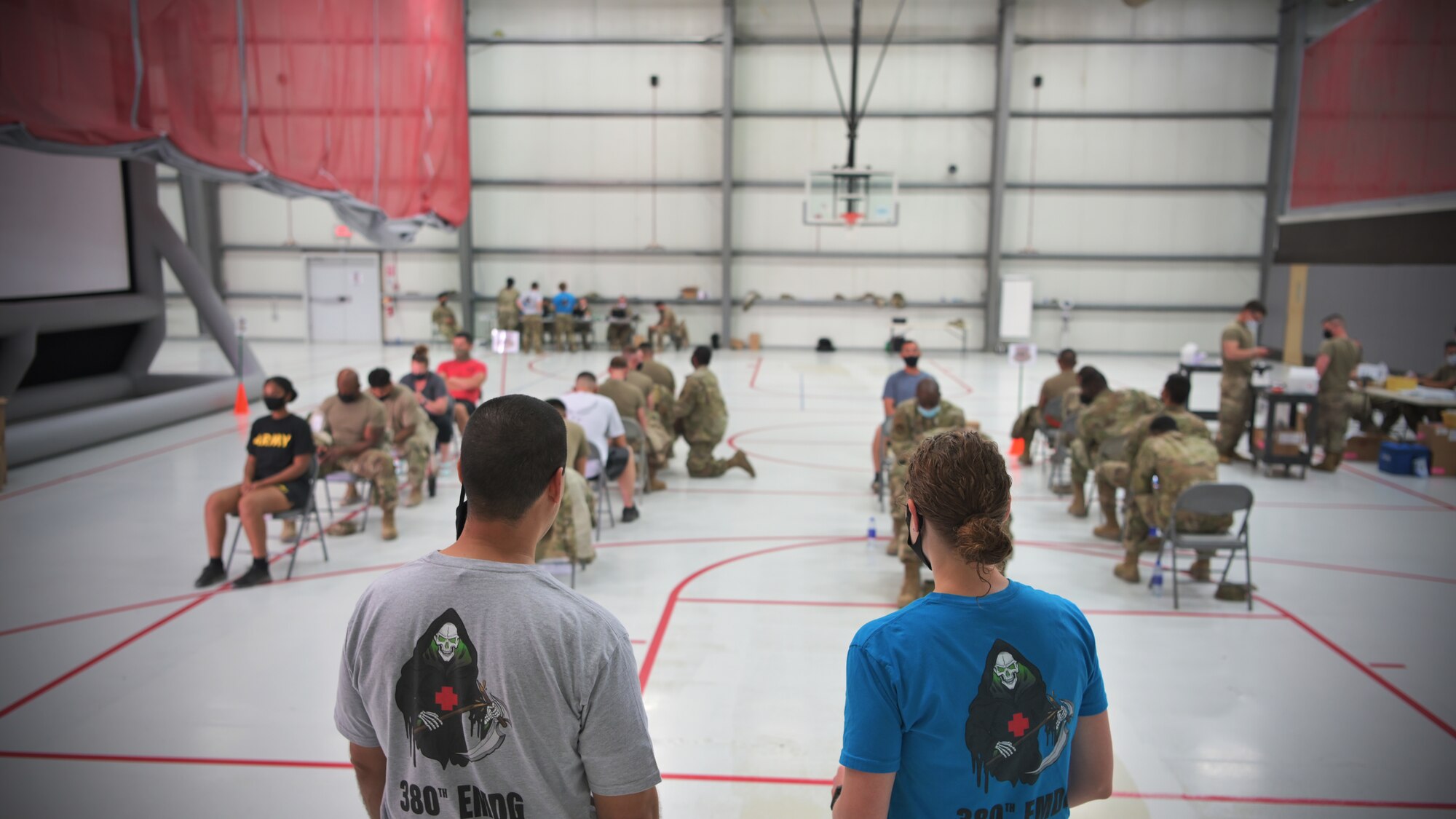 U.S. Army and Air Force troops receive their vaccinations at the COVID-19 vaccine point of distribution at Al Dhafra Air Base, United Arab Emirates, May 1, 2021. This is the second large batch of the Janssen vaccine received by the 380th EMDG, with a total of 1,400 vaccines to be administered to Department of Defense personnel in country. (U.S. Air Force photo by Staff Sgt. Jao’Torey Johnson)