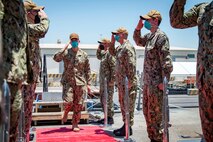 210506-N-VG727-1061 MANAMA, Bahrain (May 6, 2021) Vice Adm. Brad Cooper, commander of U.S. Naval Forces Central Command (NAVCENT), U.S. 5th Fleet and Combined Maritime Forces (CMF), salutes sideboys, assigned to Arleigh Burke-class guided-missile destroyer USS Thomas Hudner (DDG 116), during a port call in Manama, Bahrain, May 6.  Thomas Hudner is deployed to the U.S. 5th Fleet area of operations and conducting naval operations to ensure maritime stability and security in the Central Region, connecting the Mediterranean and the Pacific through the western Indian Ocean and three strategic choke points. (U.S. Navy photo by Mass Communication Specialist 2nd Class William Collins III)