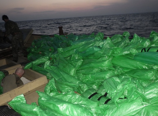 Sailors from the guided-missile cruiser USS Monterey (CG 61) inventory shipment of illicit weapons interdicted from a stateless dhow in international waters of the North Arabian Sea.