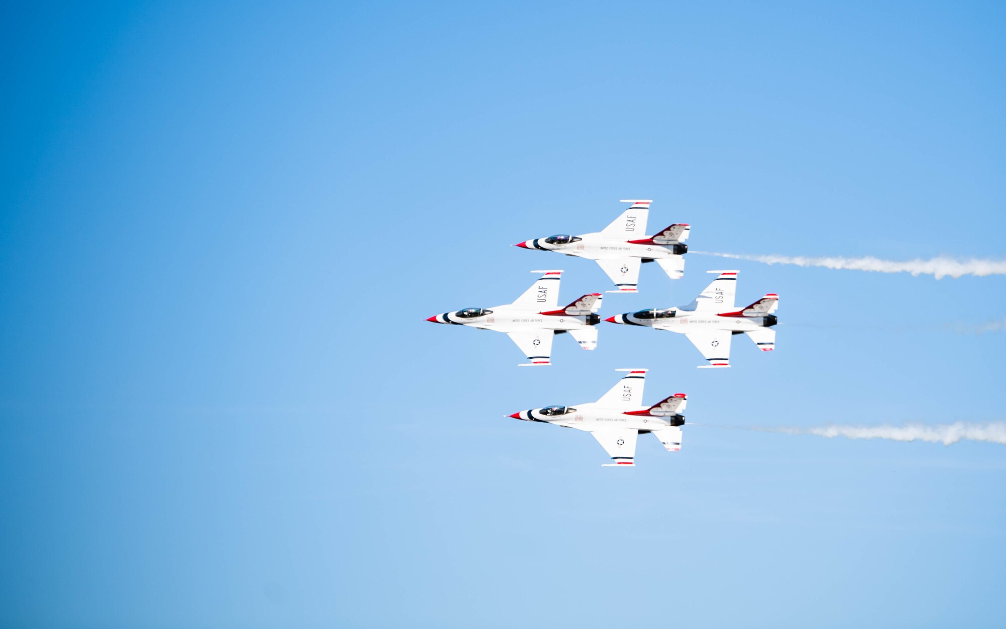 The United States Air Force Air Demonstration Squadron “Thunderbirds'' perform an aerial maneuver at the 2021 Barksdale Air Force Base Defenders of Liberty Air Show at Barksdale Air Force Base, Louisiana, May 7, 2021. Barksdale's Air Show showcased performances from the Thunderbirds, F-22 Raptor Demonstration Team and a host of additional acts. (U.S. Air Force photo by Senior Airman Jacob B. Wrightsman)