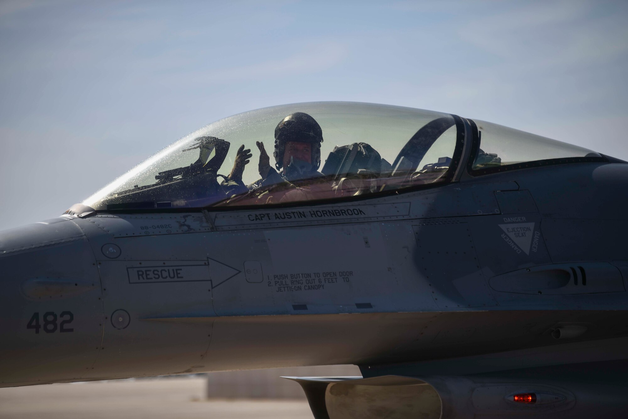 man clapping from inside a jet