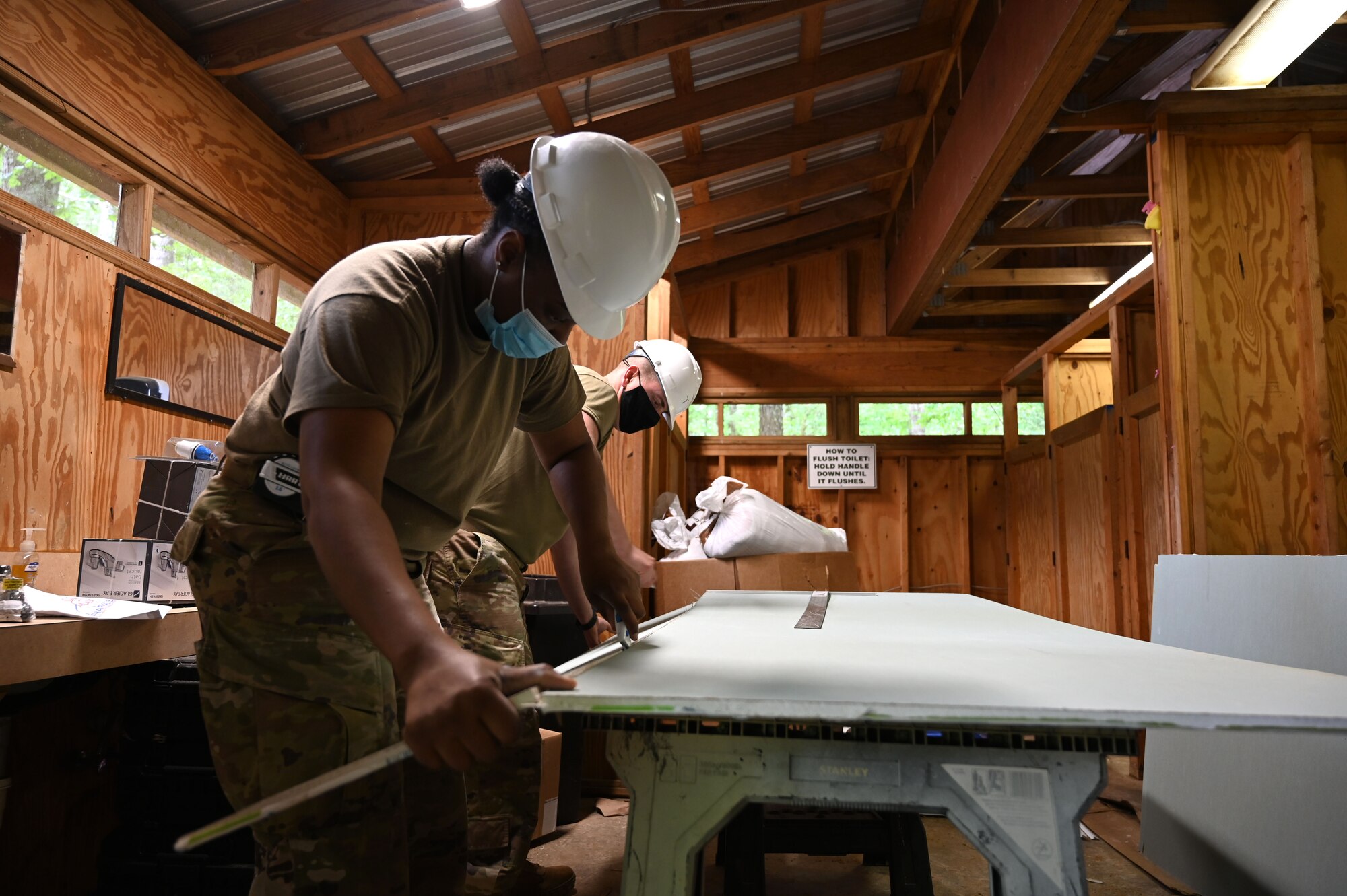 Photo of Airmen working on a construction project.