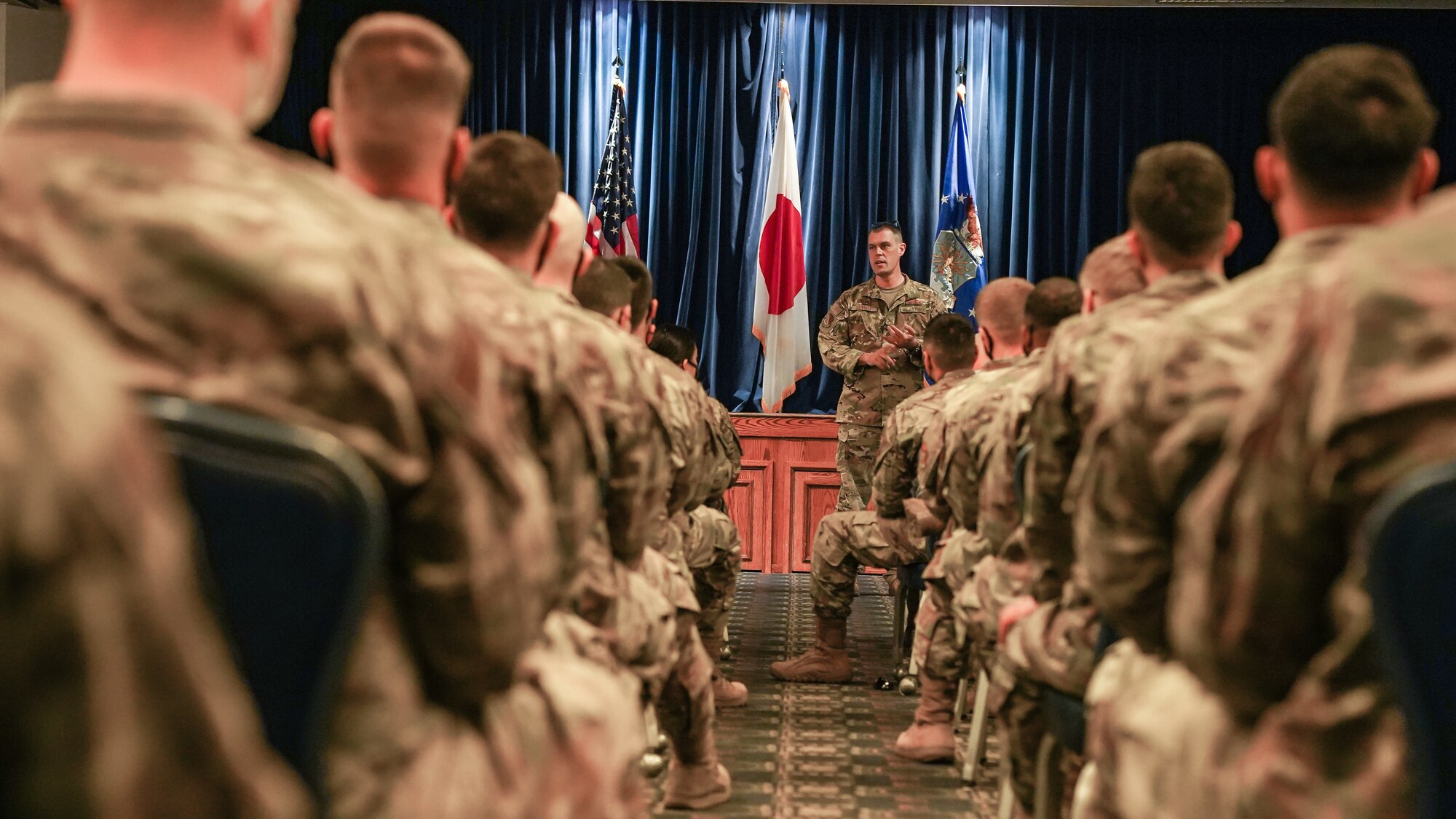 Colonel Campbell speaks to a crowd in the Enlisted Club