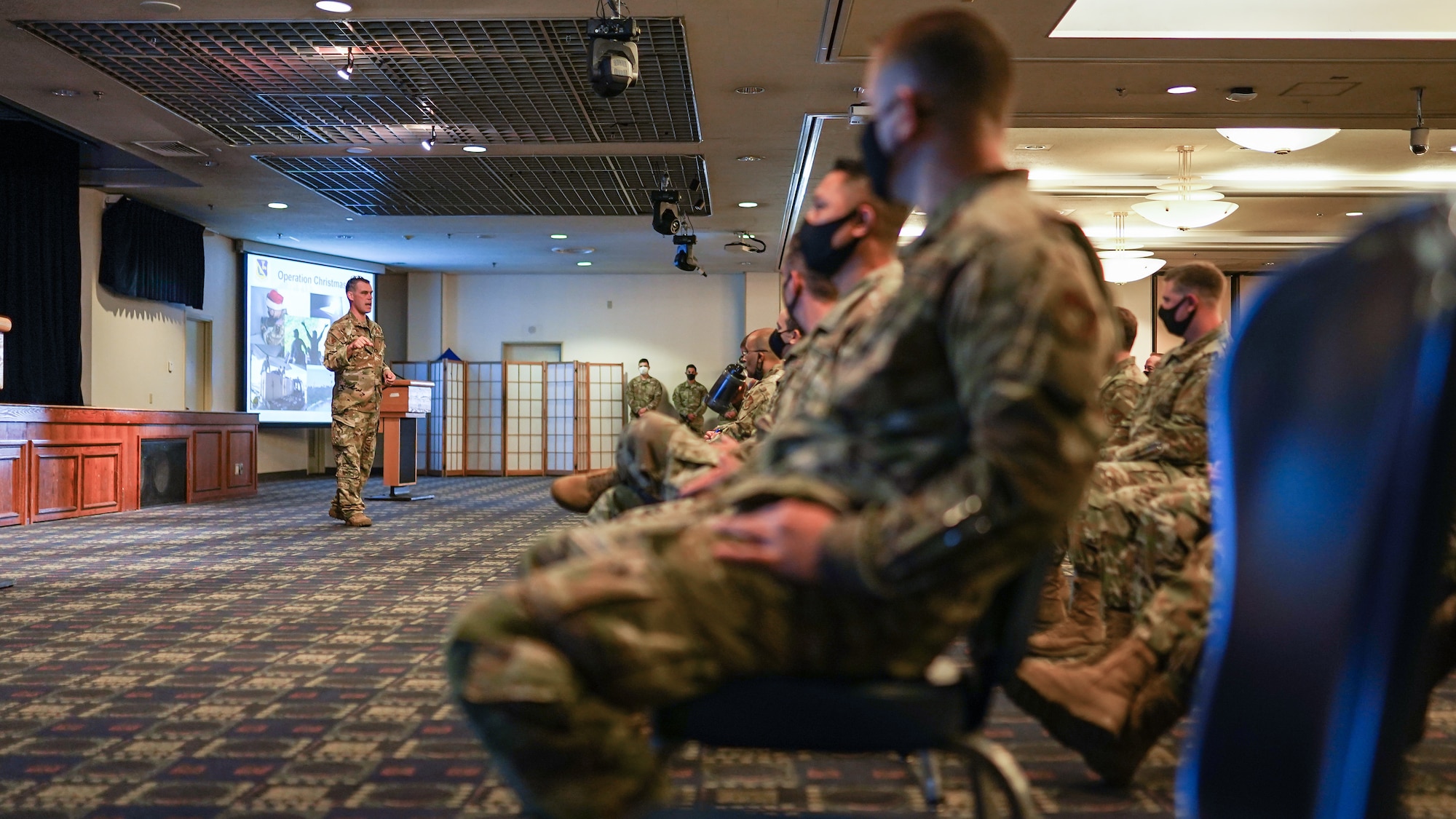 Colonel Campbell speaks to a crowd in the Enlisted Club