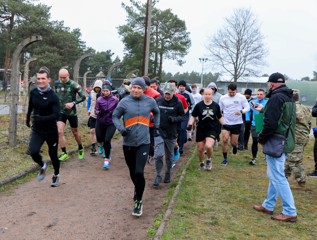 U.S. and Polish Army Soldiers take off from the start line at the inaugural Better Opportunities for Single Soldiers Poland event, a 5K competition held at Zagan Forward Operating Station, Poland, April 15, 2021. BOSS Poland is the first-ever BOSS program to be established for deployed and rotational troops, instituted by a U.S. Army Reserve civil affairs team. (Photo by Maj. Marcellus Simmons, 1-1 ABCT Public Affairs)