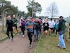 U.S. and Polish Army Soldiers take off from the start line at the inaugural Better Opportunities for Single Soldiers Poland event, a 5K competition held at Zagan Forward Operating Station, Poland, April 15, 2021. BOSS Poland is the first-ever BOSS program to be established for deployed and rotational troops, instituted by a U.S. Army Reserve civil affairs team. (Photo by Maj. Marcellus Simmons, 1-1 ABCT Public Affairs)