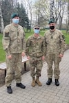 Sgt. Bradley Taylor, center, a medic with the Pennsylvania National Guard's 108th Medical Company Area Support, with two Lithuanian Army Soldiers on a Lithuanian Army base in Marijampole, Lithuania, where Taylor is providing medical support to U.S and Lithuanian troops. The 108th MCAS deployed to Europe in late February to provide medical support to U.S. and allied rotational forces in the region.