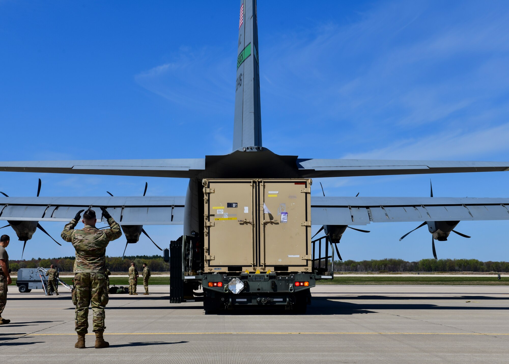 Airmen offload cargo from a C-130J Super Hercules