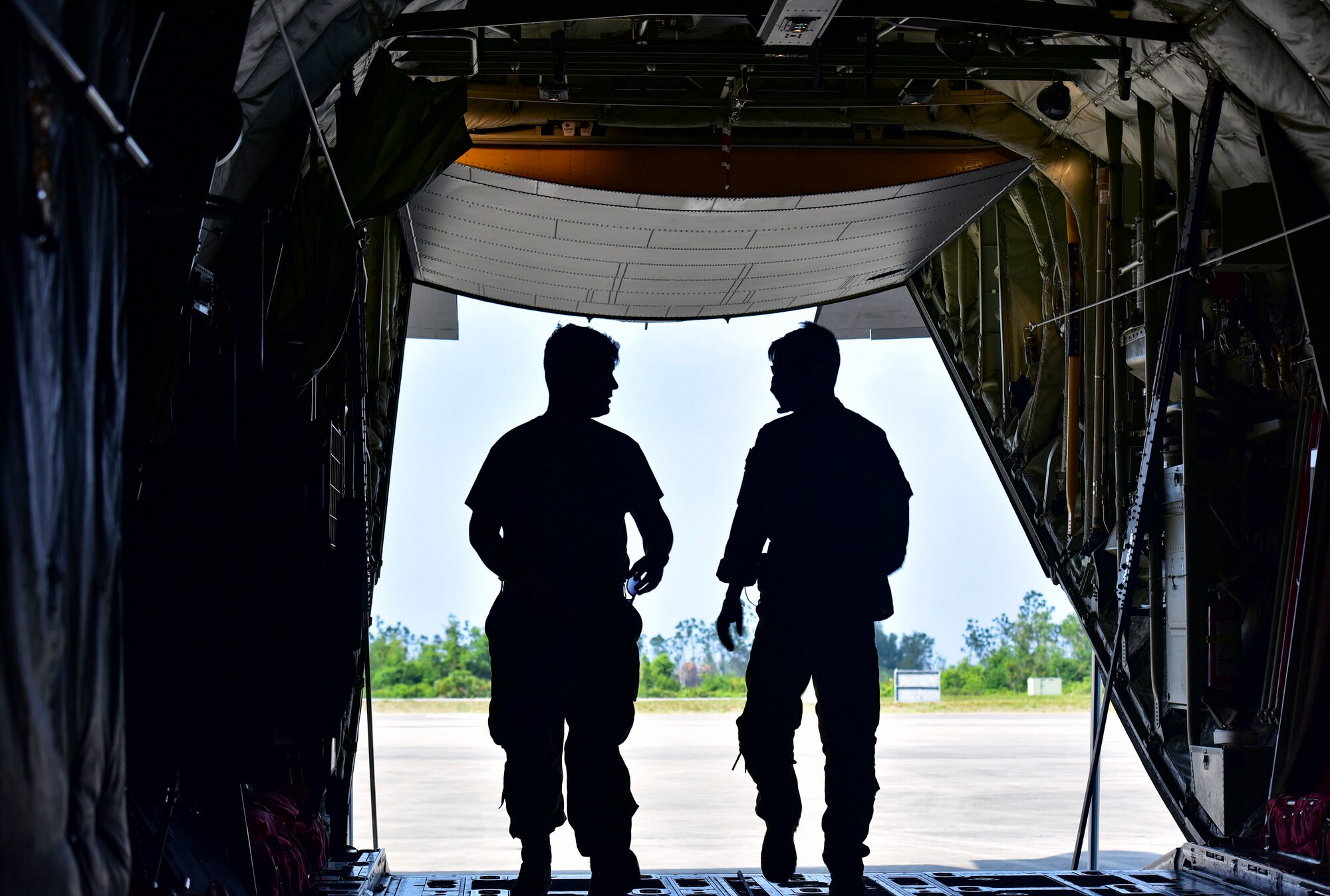 Loadmaster look out of a C-130J Super Hercules