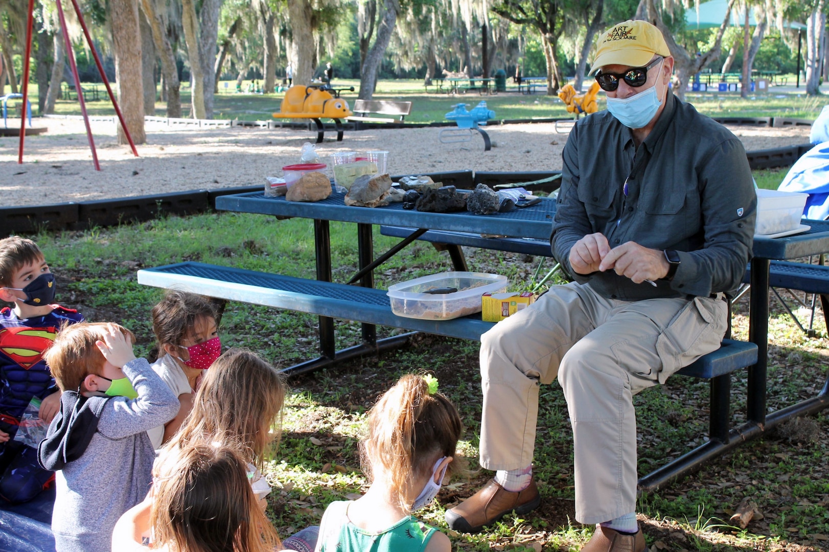 Geologist talks to children.