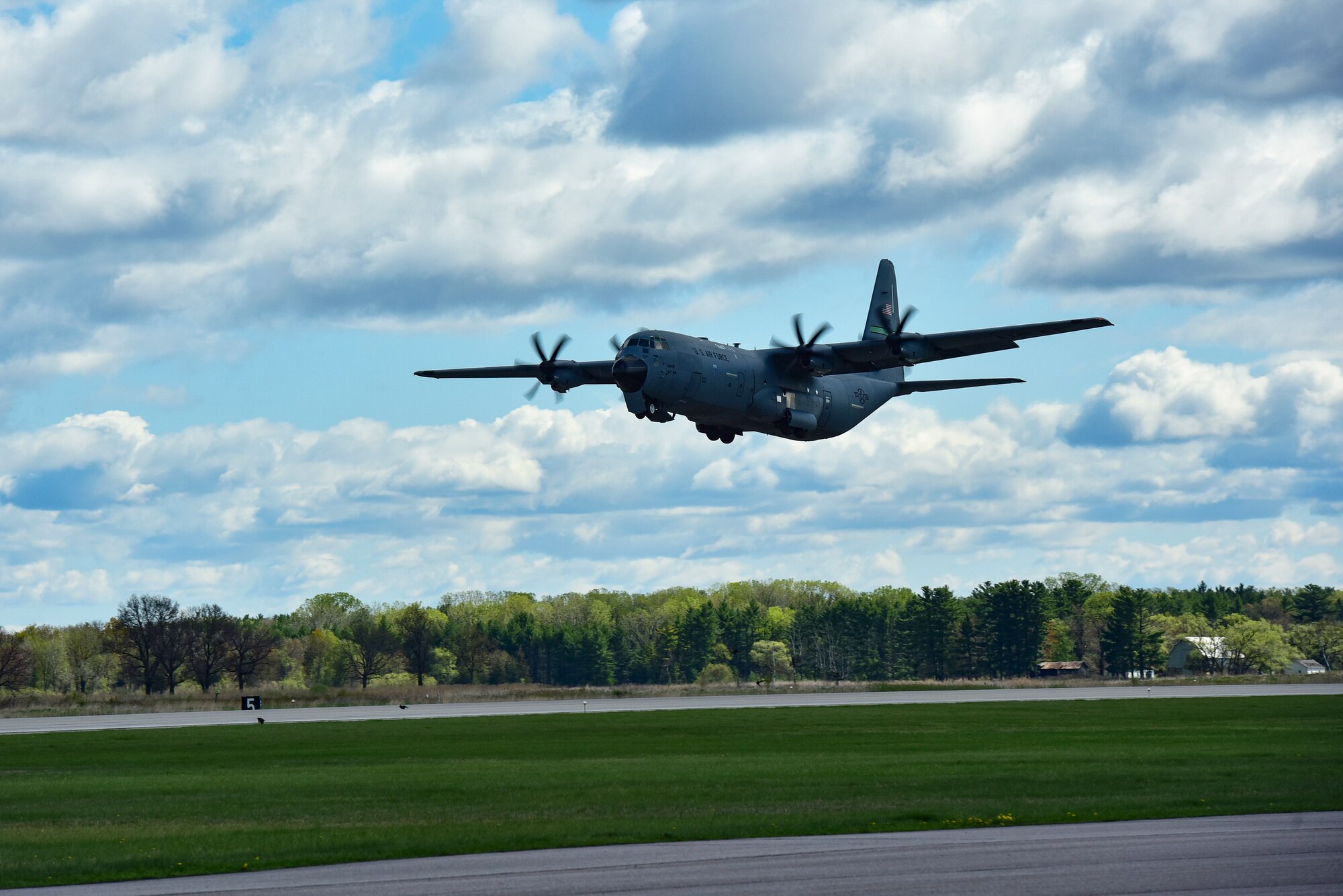 A C-130J Super Hercules assigned to the 19th Airlift Wing takes off from Volk Field Air National Guard Base