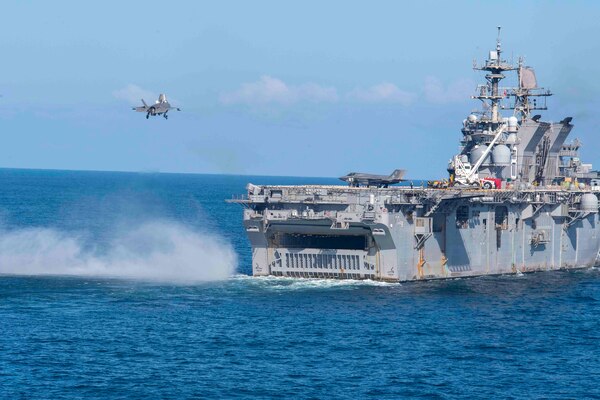 An F-35B Lightning II prepares to land on the amphibious assault ship USS Makin Island (LHD 8).