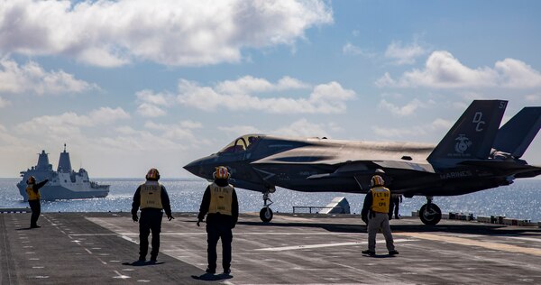 Aviation Boatswain’s Mate 1st Class Jenna Leggett directs a U.S. Marine Corps F-35B Lightning II.