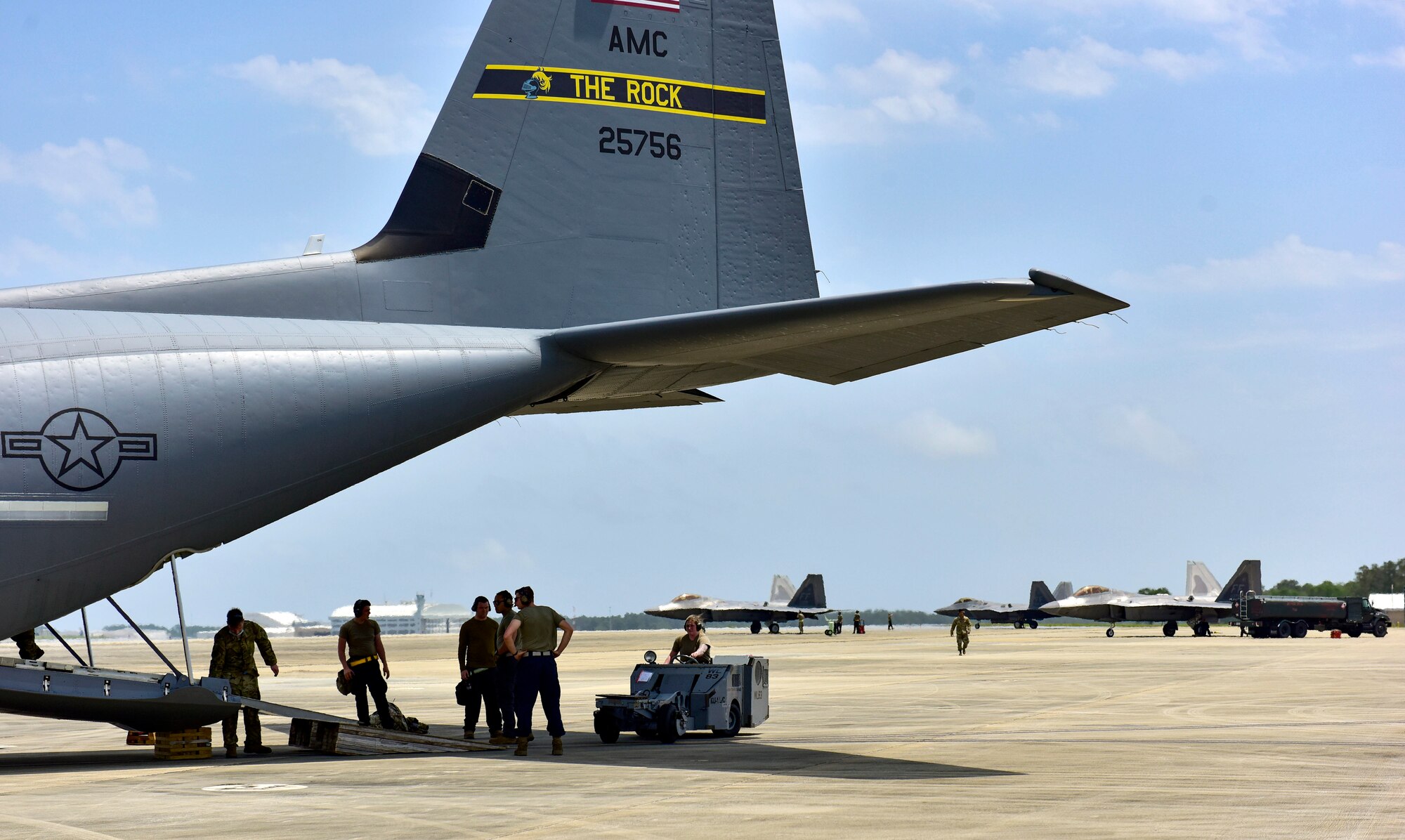 Airmen from the 27th Fighter Squadron weapons load crew load two MJ-1 Bomb Lifter “Jammers” onto a C-130J Super Hercules
