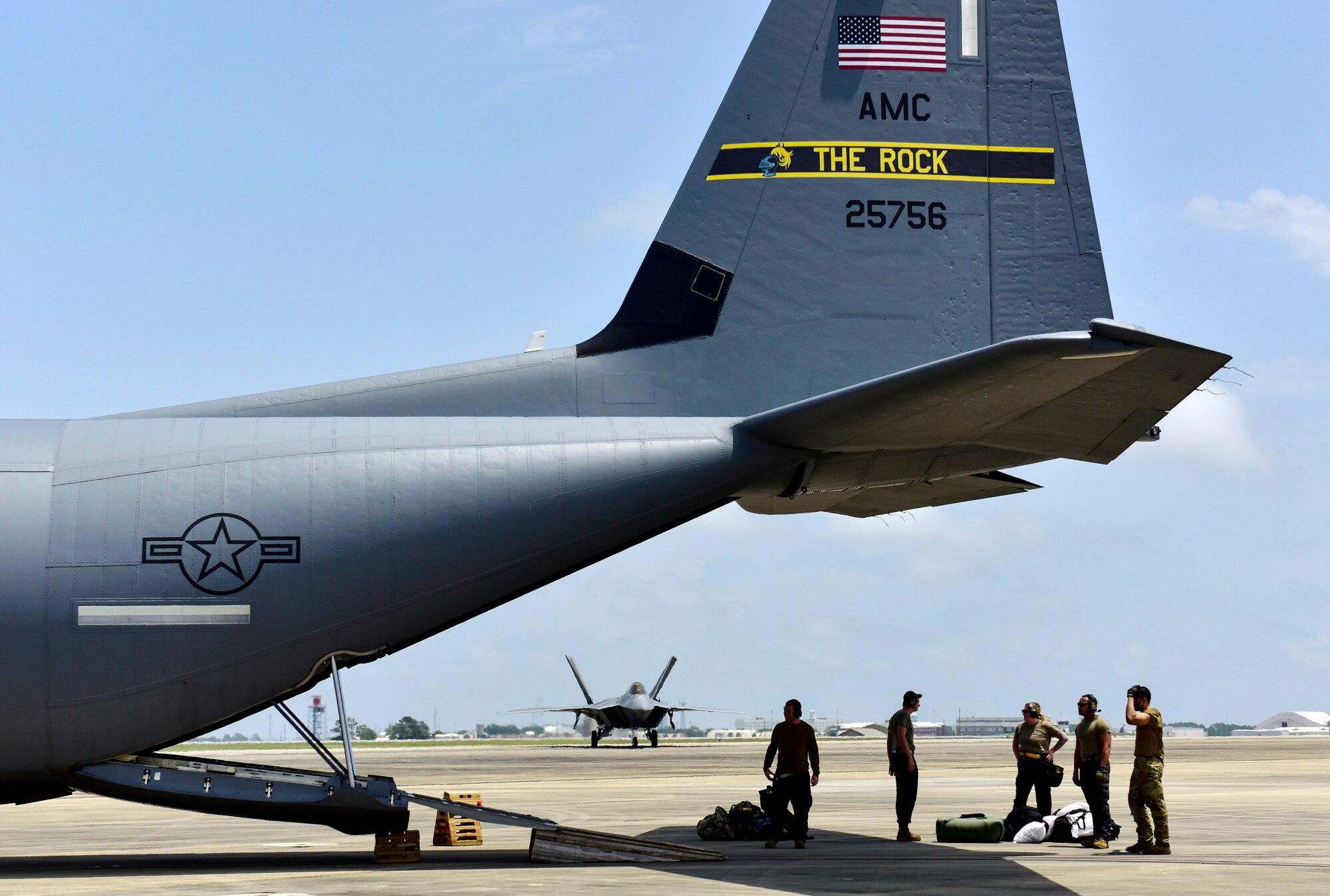 Airmen assigned to the 19th Airlift Wing offload cargo from a C-130J Super Hercules