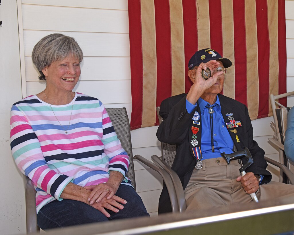 Bradford Freeman holds a coin from the Chairman of the Joint Chiefs of Staff.