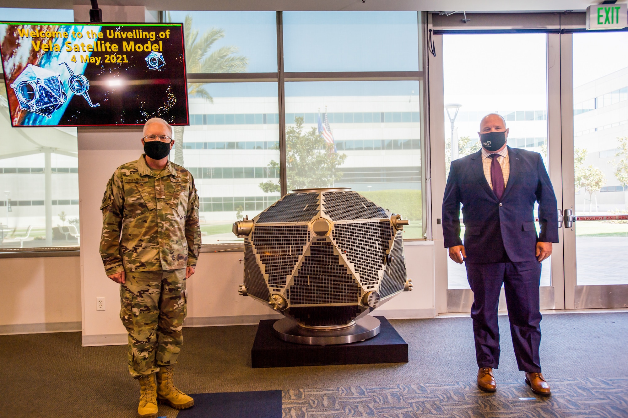 Lt. Gen. John F. Thompson, Space and Missile Systems Center commander and Air Force Program Executive Officer for Space, left, and Tom Wilson, vice president and general manager of the Strategic Space Systems Division of Northrop Grumman, stand in front of a full-scale Vela satellite model at SMC's Heritage Center in Los Angeles, California, May 4, 2021. Originated in 1960, Vela was the first space-based system used for nuclear surveillance. Today, the mission of monitoring nuclear detonations continues with payloads hosted on GPS satellites. (U.S. Space Force photo by Van Ha)