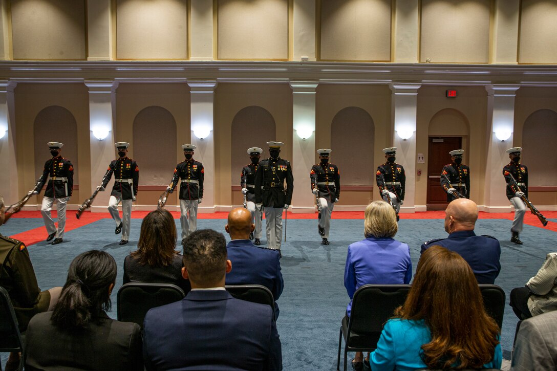Marines with the Silent Drill Platoon march into formation during the Friday Evening Parade at Marine Barracks Washington, D.C., May 7, 2021. The 38th Commandant of the Marine Corps Gen. David H. Berger hosted the ceremony, and the following service chiefs were the guests of honor: Chief of Naval Operations Adm. Michael Gilday, Chief of Space Operations Gen. John W. "Jay" Raymond, Chief of Staff of the U.S. Air Force Gen. Charles Q. Brown, Jr., Chief of the National Guard Bureau Gen. Daniel R. Hokanson, and Commandant of the U.S. Coast Guard Adm. Karl L. Schultz. (U.S. Marine Corps photo by Lance Cpl. Tanner D. Lambert)