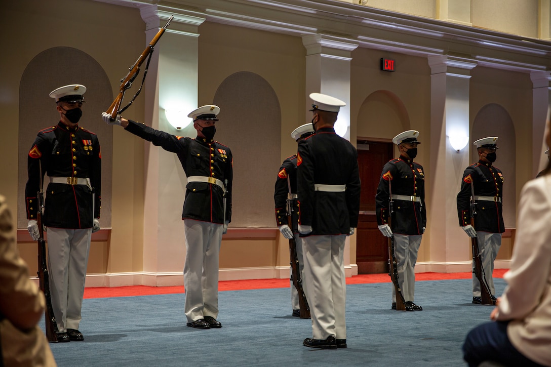 Lance Cpl. Tyler Ness, rifleman, Silent Drill Platoon, prepares for a rifle inspection during the Friday Evening Parade at Marine Barracks Washington, D.C., May 7, 2021.