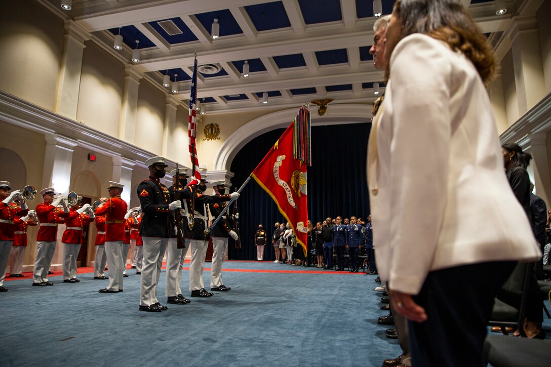 Marines with the Official Marine Corps Color Guard present the National Ensign during the Friday Evening Parade at Marine Barracks Washington, D.C., May 7, 2021. The 38th Commandant of the Marine Corps Gen. David H. Berger hosted the ceremony, and the following service chiefs were the guests of honor: Chief of Naval Operations Adm. Michael Gilday, Chief of Space Operations Gen. John W. "Jay" Raymond, Chief of Staff of the U.S. Air Force Gen. Charles Q. Brown, Jr., Chief of the National Guard Bureau Gen. Daniel R. Hokanson, and Commandant of the U.S. Coast Guard Adm. Karl L. Schultz. (U.S. Marine Corps photo by Lance Cpl. Tanner D. Lambert)