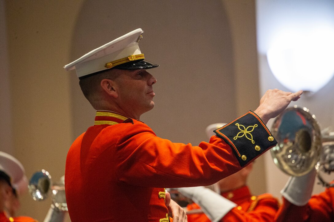 Capt. Nathan D. Morris, assistant director, “The Commandant’s Own” United States Marine Drum and Bugle Corps, directs Marines during the Friday Evening Parade at Marine Barracks Washington, D.C., May 7, 2021. The 38th Commandant of the Marine Corps Gen. David H. Berger hosted the ceremony, and the following service chiefs were the guests of honor: Chief of Naval Operations Adm. Michael Gilday, Chief of Space Operations Gen. John W. "Jay" Raymond, Chief of Staff of the U.S. Air Force Gen. Charles Q. Brown, Jr., Chief of the National Guard Bureau Gen. Daniel R. Hokanson, and Commandant of the U.S. Coast Guard Adm. Karl L. Schultz. (U.S. Marine Corps photo by Lance Cpl. Tanner D. Lambert)