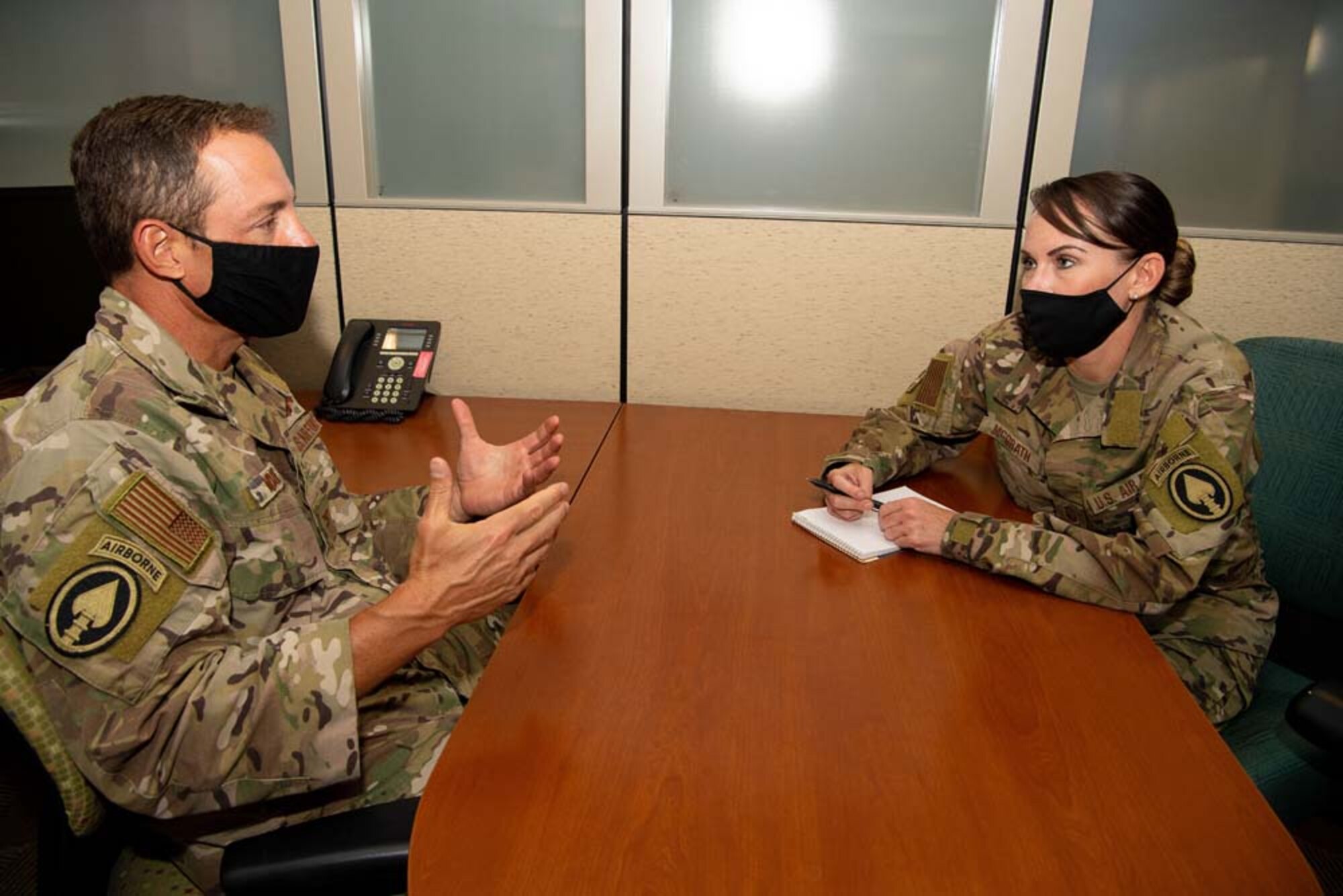 Col. Austin Moore, the Air Force Reserve Command reserve advisor to U.S. Special Operations Command, meets with Master Sgt. Lisa McGrath, a SOCOM individual mobilization augmentee, at MacDill Air Force Base, Florida, May 6, 2021.