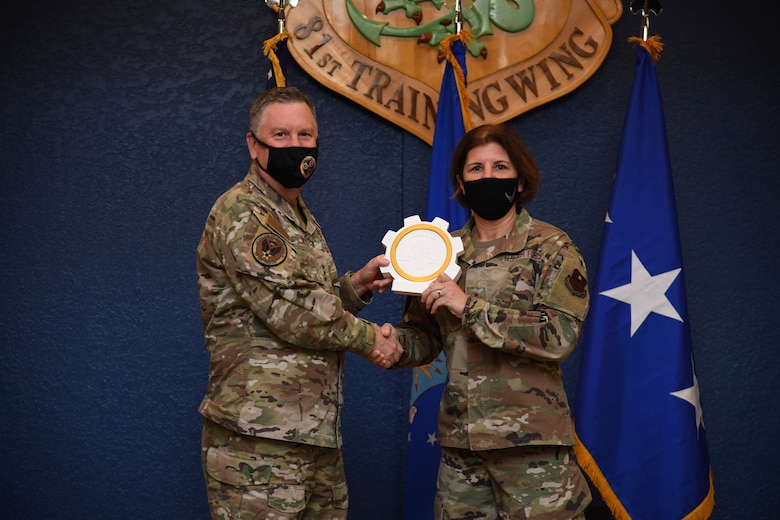Winner receiving award from Lt. Gen. Webb