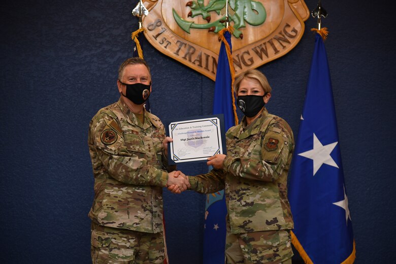 Winner receiving award from Lt. Gen. Webb