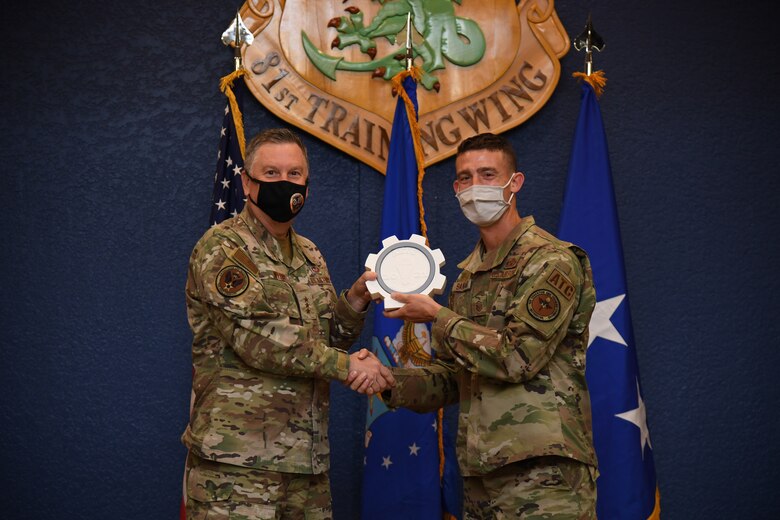 Winner receiving award from Lt. Gen. Webb