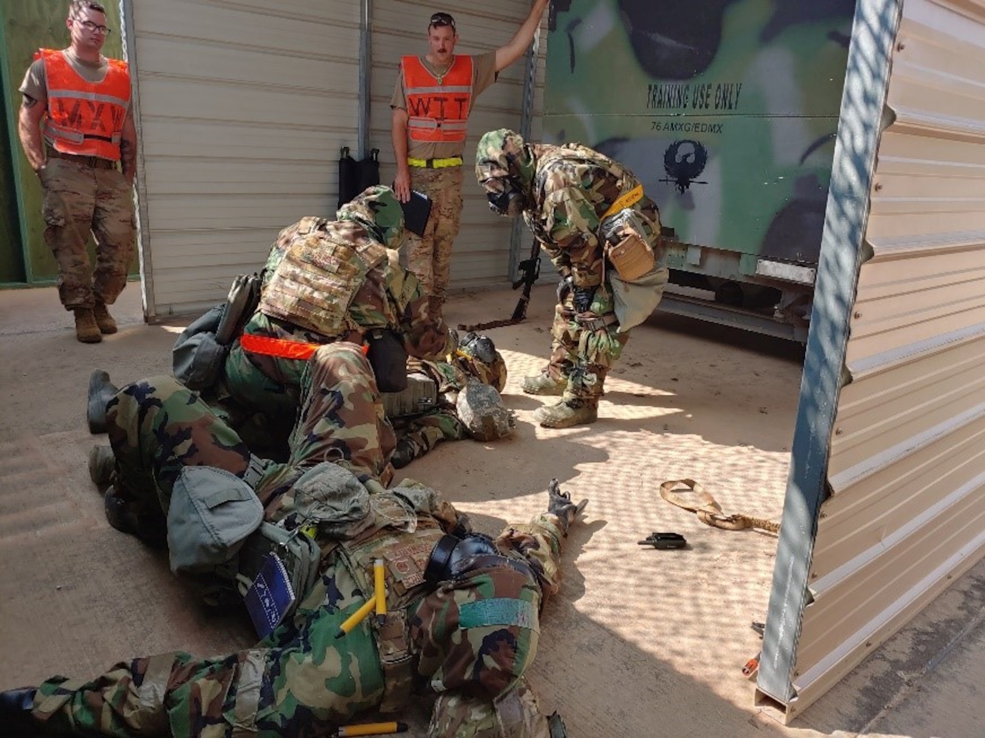 Airmen assisting injured person