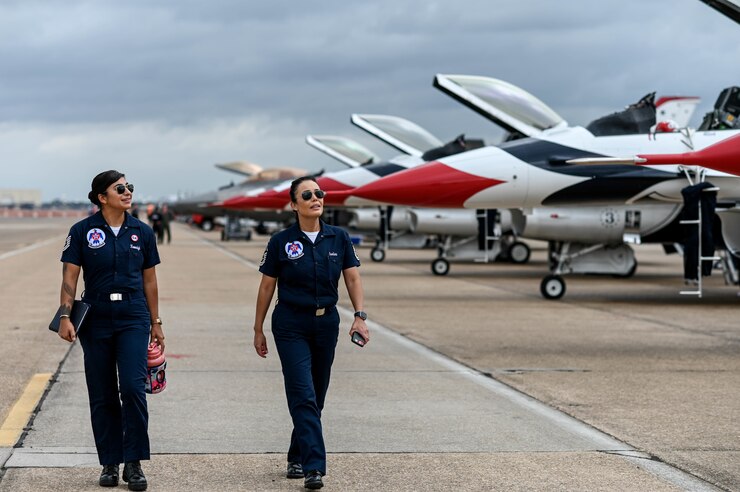 Airmen assigned to the U.S. Air Force Air Demonstration Squadron, “Thunderbirds," approach their aircraft at the 2021 Defenders of Liberty Air & Space Show at Barksdale Air Force Base, Louisiana, May 9, 2021. As the U.S. Air Force's premier aerial demonstration team, the Thunderbirds showcase the pride and precision of today's Air Force. (U.S. Air Force photo by Senior Airman Christina Graves)