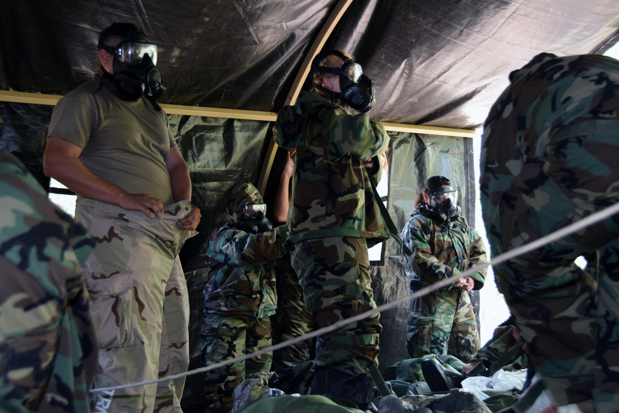 433rd Airlift Wing Reserve Citizen Airmen don mission-oriented protective posture equipment in anticipation of a simulated chemical weapon attack May 3, 2021 during the wing’s Exercise Alamo Bravo at Joint Base San Antonio-Lackland, Texas. The Airmen received intelligence a simulated attack was imminent. (U.S. Air Force photo by Tech. Sgt. Iram Carmona)