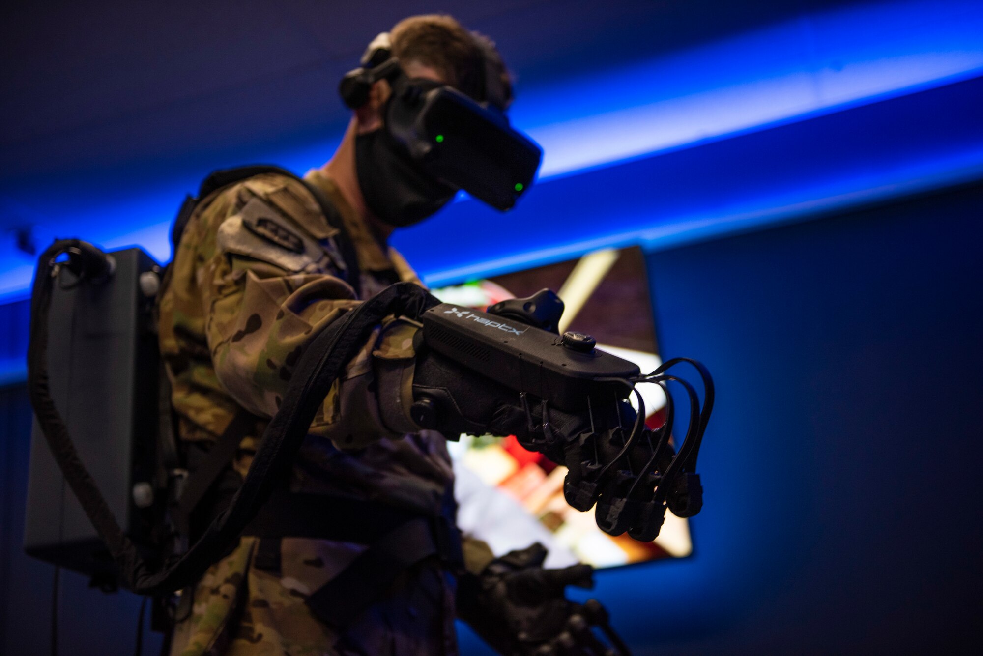 Col. James Young, 317th Airlift Wing commander, tests HaptX Gloves Development Kit 2 at Dyess Air Force Base, Texas, May 10, 2021. The DK2 Gloves can provide an added physical element to a virtual reality training environment. (U.S. Air Force photo by Airman 1st Class Colin Hollowell)