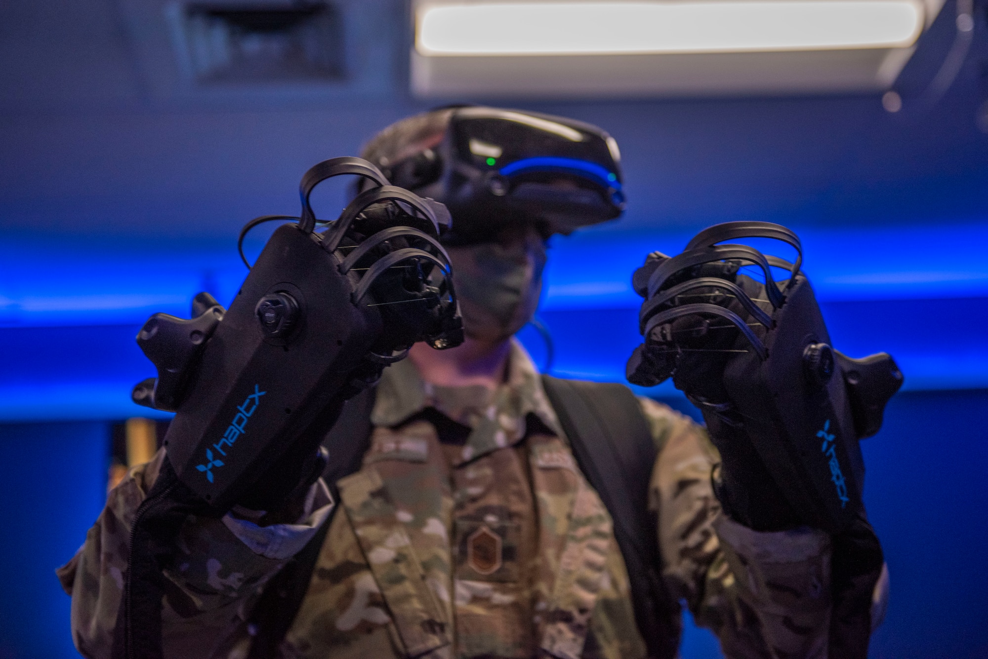 Chief Master Sgt. Mark Umfleet, 317th Airlift Wing command chief, tests HaptX Gloves Development Kit 2 at Dyess Air Force Base, Texas, May 10, 2021. Introducing virtual reality gloves into a training environment allows students to feel each action as it is performed. (U.S. Air Force photo by Airman 1st Class Colin Hollowell)