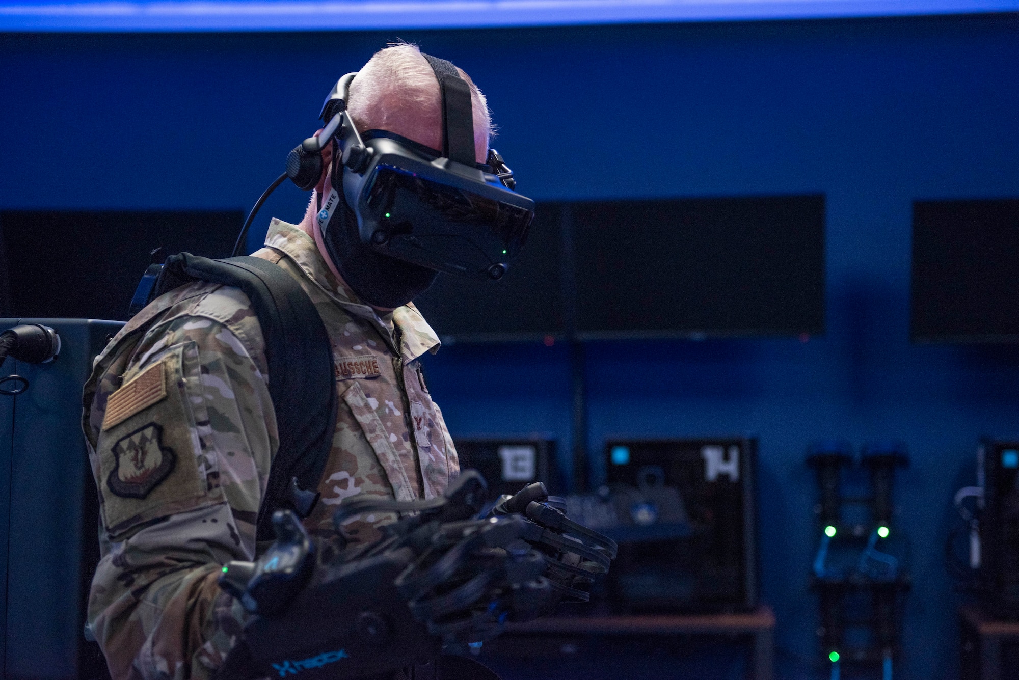Col. Michael Fellona, 317th Airlift Wing vice commander, tests HaptX Gloves Development Kit 2 at Dyess Air Force Base, Texas, May 10, 2021. Leadership assigned to the 317th AW tested the DK2 Gloves where they saw first-hand how the gloves operated and could potentially integrate with the existing virtual reality training lab. (U.S. Air Force photo by Airman 1st Class Colin Hollowell)