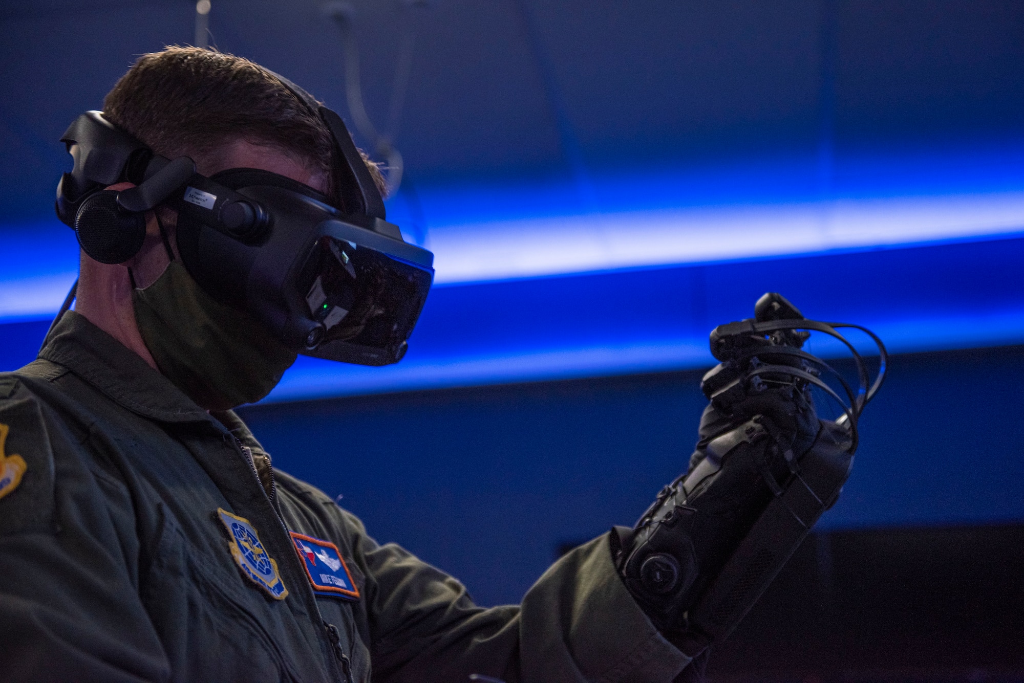 Col. Michael Fellona, 317th Airlift Wing vice commander, tests HaptX Gloves Development Kit 2 at Dyess Air Force Base, Texas, May 10, 2021. Leadership assigned to the 317th AW tested the DK2 Gloves where they saw first-hand how the gloves operated and could potentially integrate with the existing virtual reality training lab. (U.S. Air Force photo by Airman 1st Class Colin Hollowell)