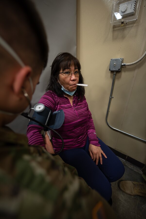 U.S. Air National Guard Major Raymond Martin, 102nd Medical Group, 102nd Intelligence Wing, conducts a dental exam for a Kodiak Island resident during Arctic Care 2021 in Kodiak, Alaska, on May 5, 2021. Arctic Care 2021 provides medical troops and support personnel “hands-on” readiness training while providing no-cost medical care to the people of Kodiak, Alaska. (U.S. Marine Corps photo by Lance Cpl. Ryan Schmid)