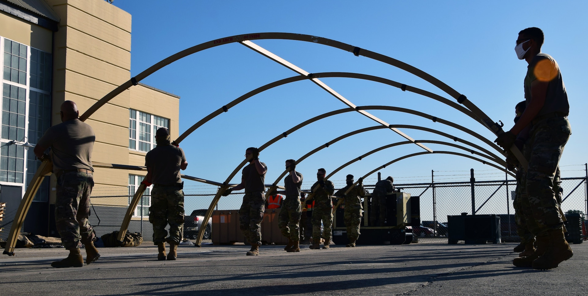 Airmen assemble tent.