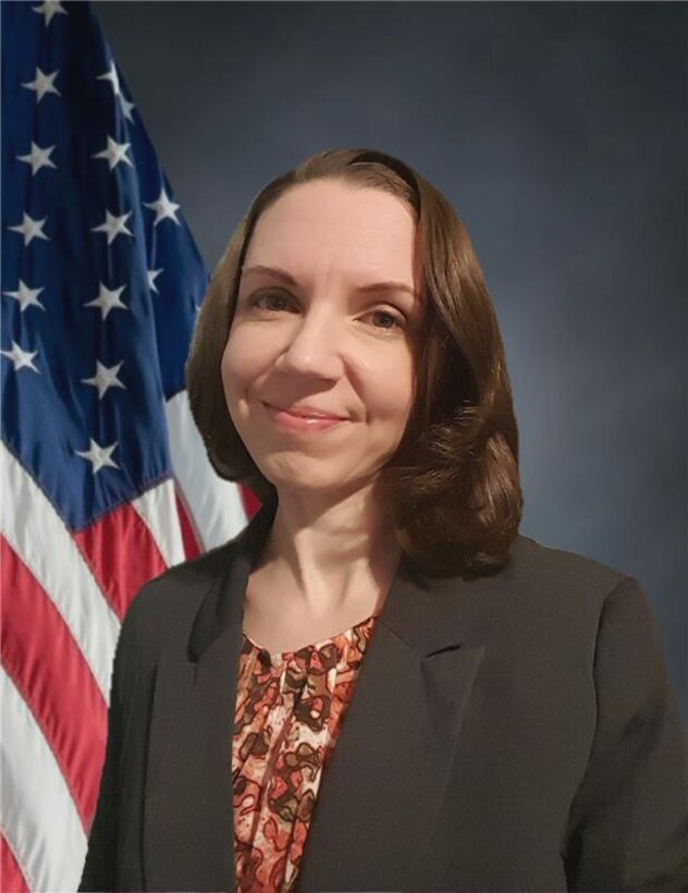Woman in front of flag