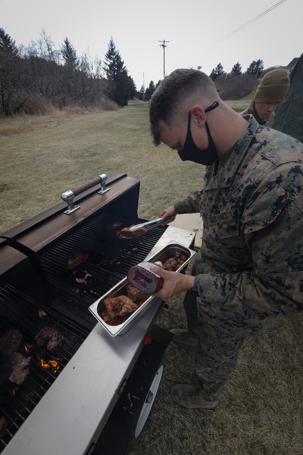 U.S. Marine Corps Cpl. Charles Squires III, a food service specialist with Combat Logistics Regiment 45, 4th Marine Logistics Group, prepares dinner for Marines during Arctic Care 2021 in Kodiak, Alaska, on May 6, 2021. Arctic Care 2021 is a joint-service training mission led by the United States Air Force and supported by members of the Air National Guard, Marines, Marine Reserves, Navy, Navy Reserves, National Guard, and Army Reserves. (U.S. Marine Corps photo by Lance Cpl. James Stanfield)