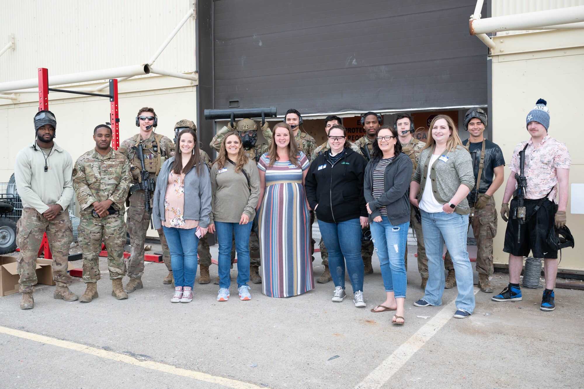 Airmen from the 341st Missile Security Operations Squadron tactical response force and military spouses pose for a photo during a tour May 7, 2021, at Malmstrom Air Force Base, Mont.