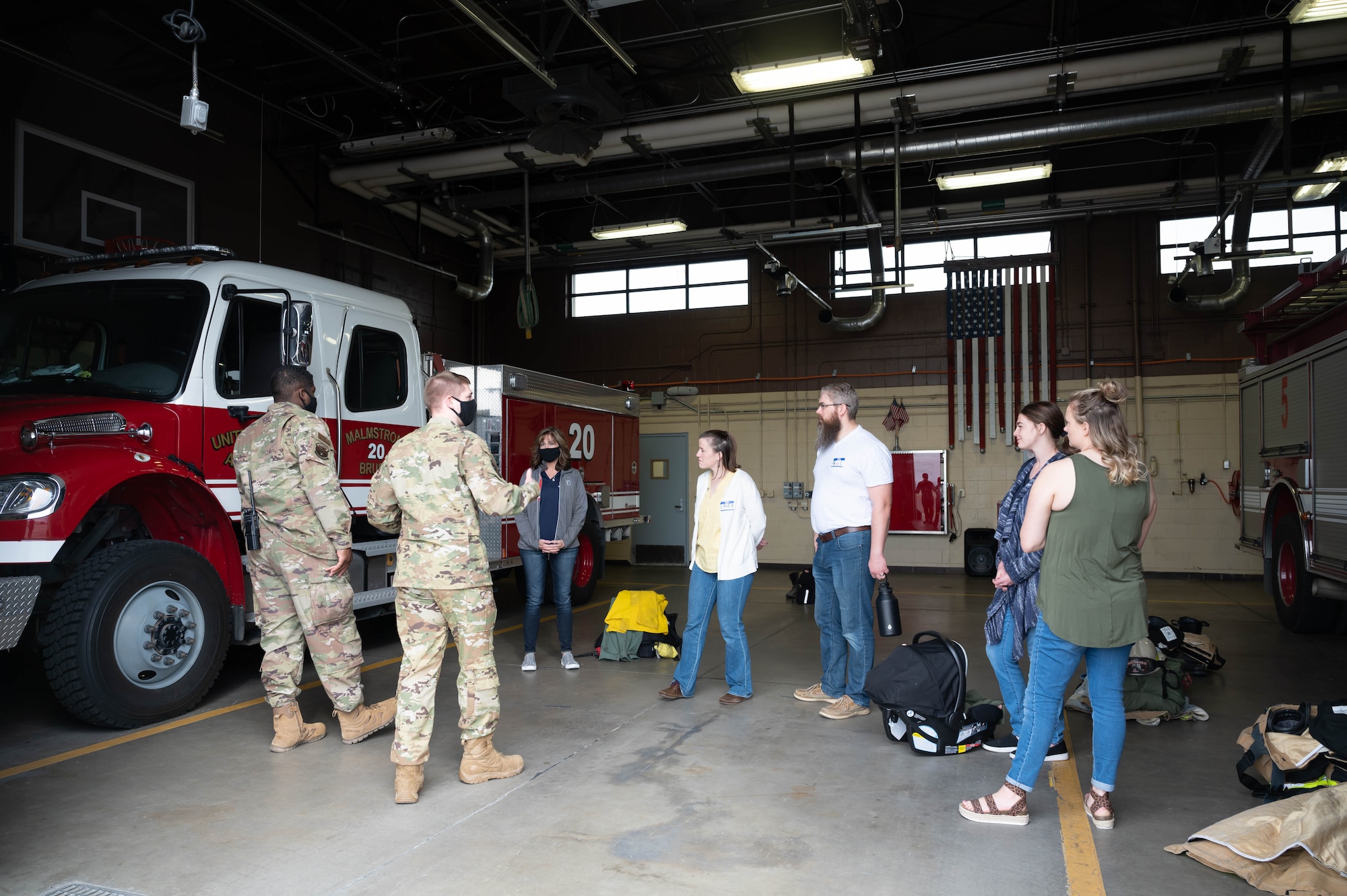 Airmen from the 341st Civil Engineer Squadron fire department give a tour of the fire house to military spouses May 7, 2021, at Malmstrom Air Force Base, Mont.