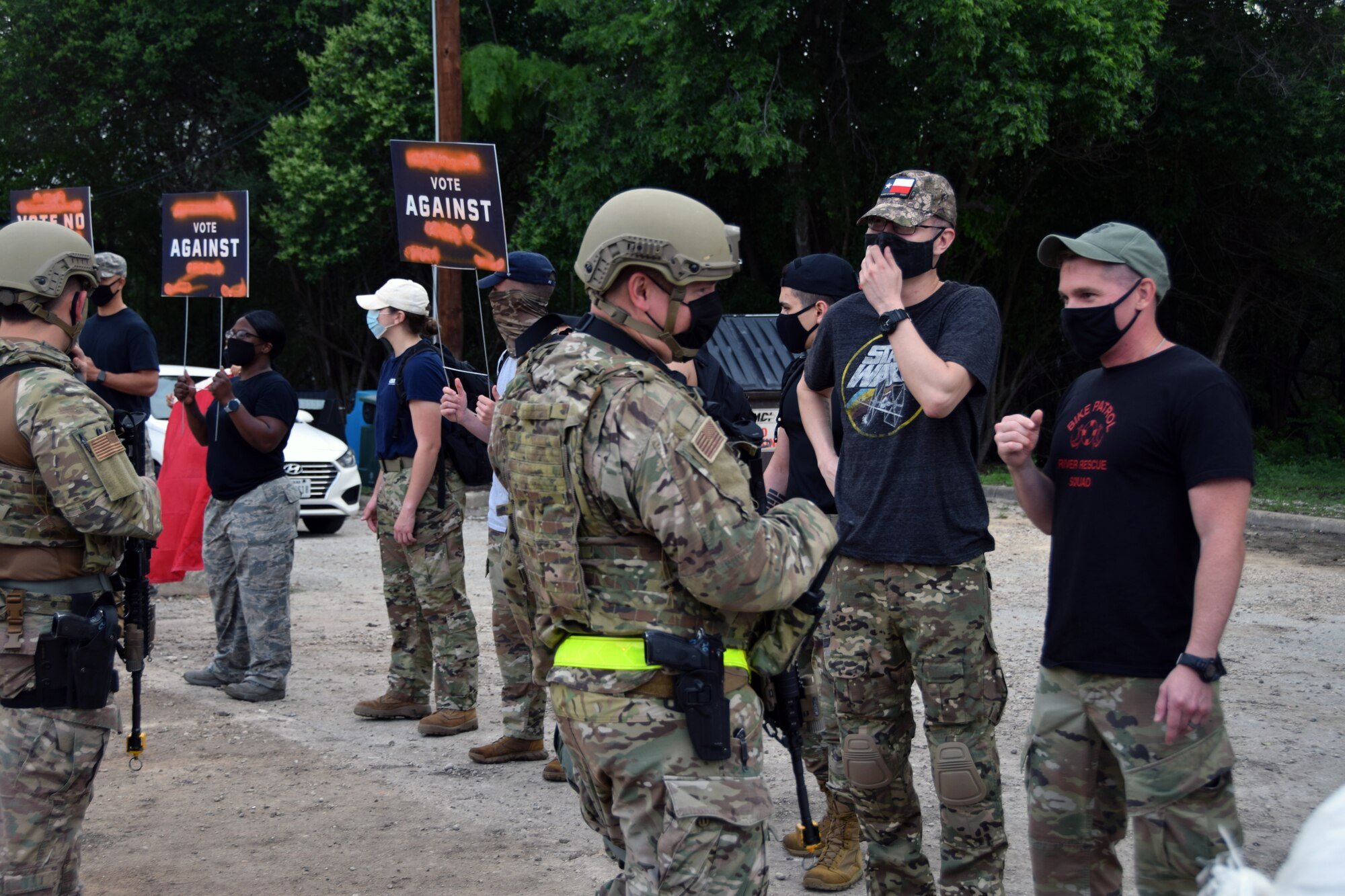 433rd Security Forces Squadron defenders secure an entry control point to prevent simulated protesters from entering the base May 3, 2021 during the 433rd Airlift Wing’s Exercise Alamo Bravo at Joint Base San Antonio-Lackland, Texas. The wing was exercising to evaluate its ability to conduct contingency operations. (U.S. Air Force photo by Tech. Sgt. Iram Carmona)